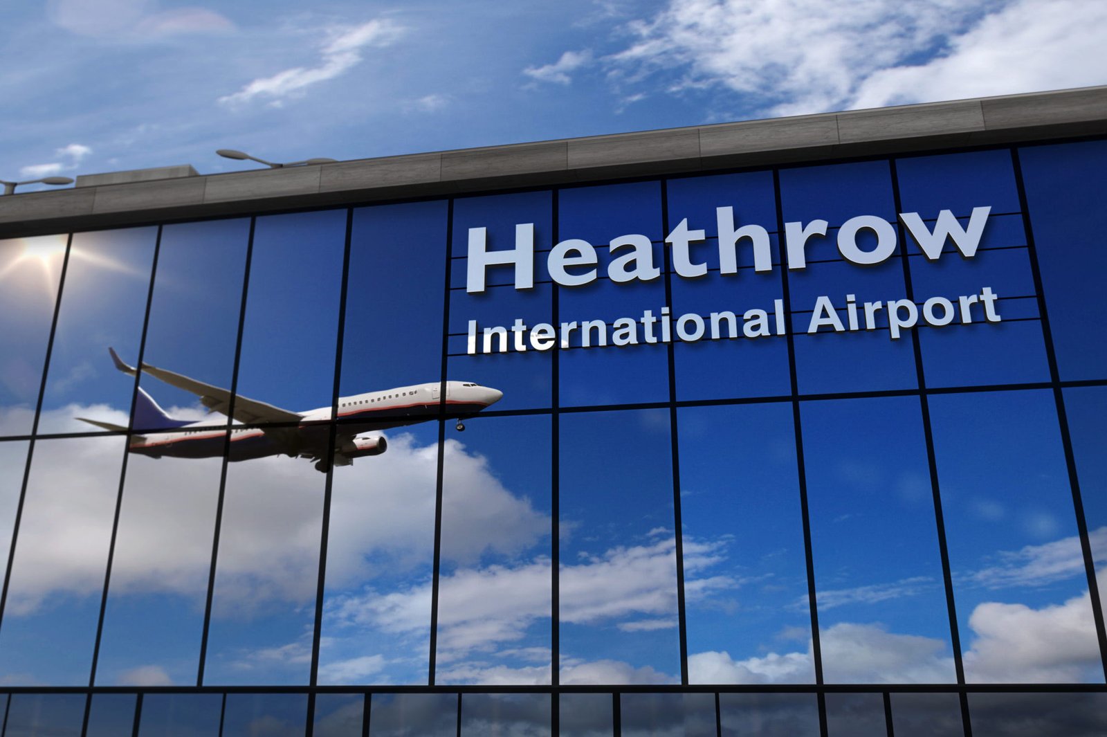 Airplane landing at London Heathrow mirrored in terminal